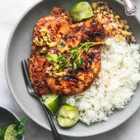 overhead chicken and pineapple salsa and white rice on gray plate